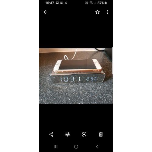 Wireless clock phone charging system